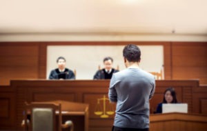 man standing trial in court