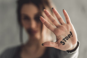 woman with stop on her hand