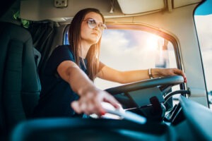 female farmer driving semi-truck